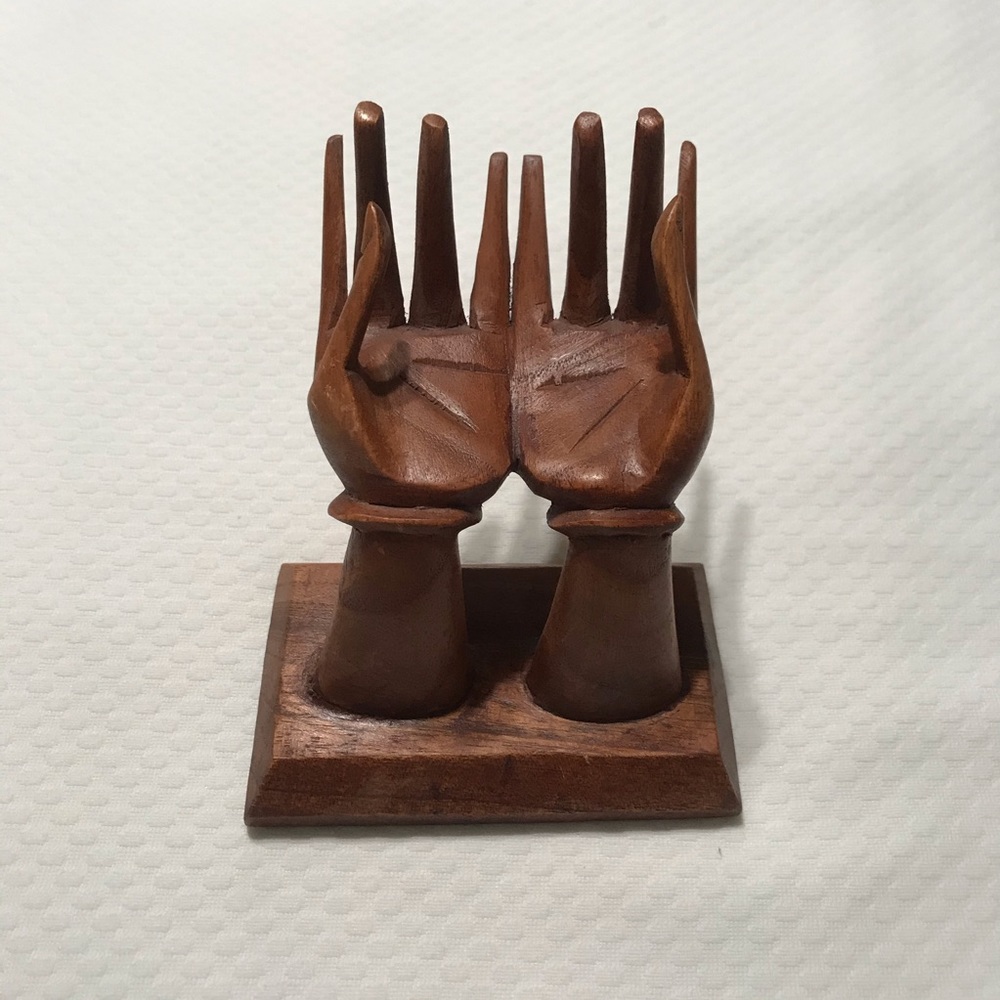 Hand carved wooden hand display made in Indonesia
